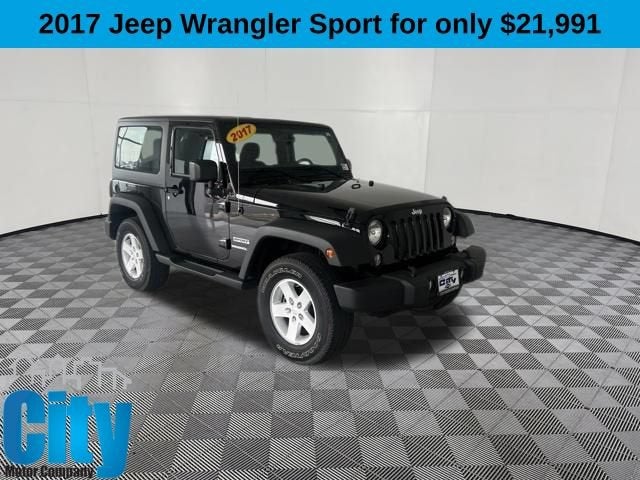 2017 Jeep Wrangler Sport in Black — front three-quarter view