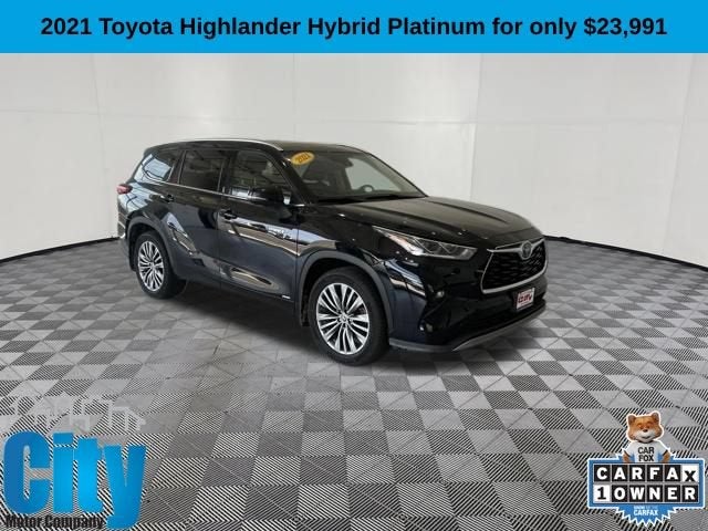 2021 Toyota Highlander Hybrid Platinum in Black — front three-quarter view